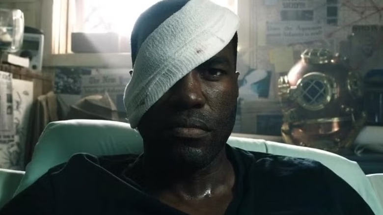 A bandaged Black Manta (Yahya Abdul-Mateen II) reclines in a bed in Aquaman