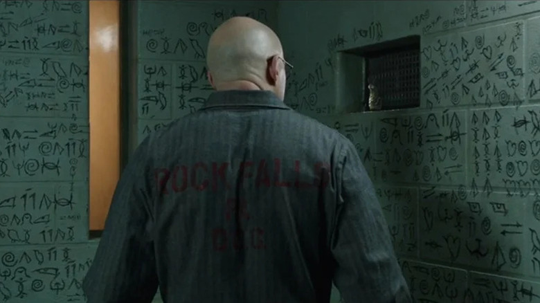 Thaddeus Sivana (Mark Strong) speaks to Mister Mind (David F. Sandberg) in Shazam!: Fury of the Gods