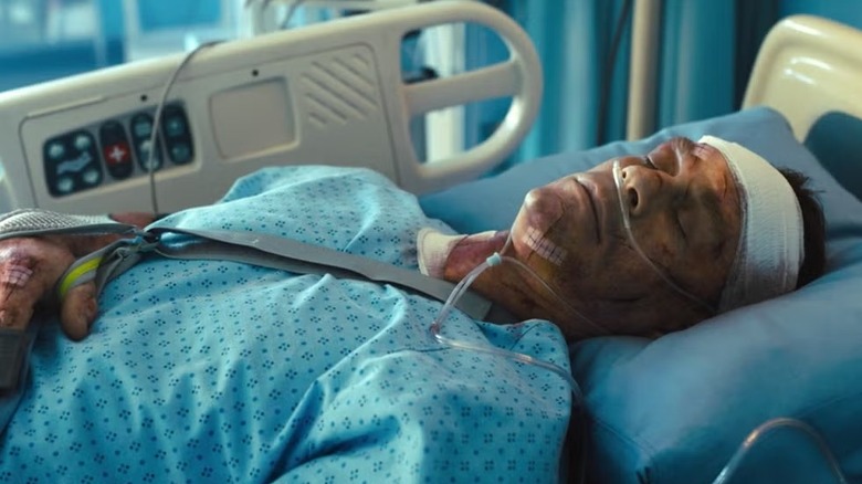 Peacemaker (John Cena) lies in a hospital bed in The Suicide Squad