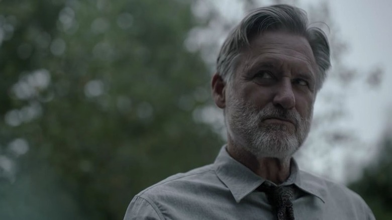 Bill Pullman in shirt and tie outside as Harry Ambrose in The Sinner