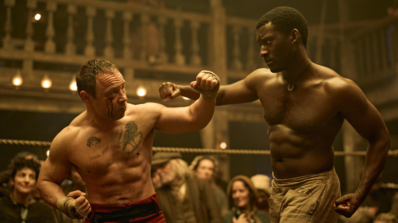 Stephen Graham as Sugar Goodson blocking a punch from Malachi Kirby as Hezekiah Moscow in A Thousand Blows