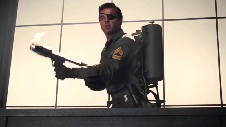 Rick Dalton (Leonardo DiCaprio) playing Sgt Mike Lewis with flamethrower in The 14 Fists of McCluskey in Once Upon a Time in Hollywood