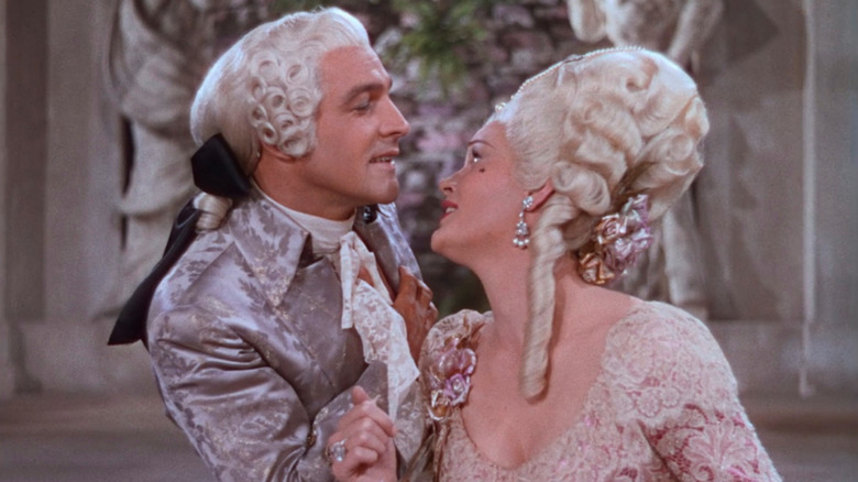 Don (Gene Kelly) and Lina (Jean Hagen) flirting in The Dueling Cavalier in Singin' in the Rain