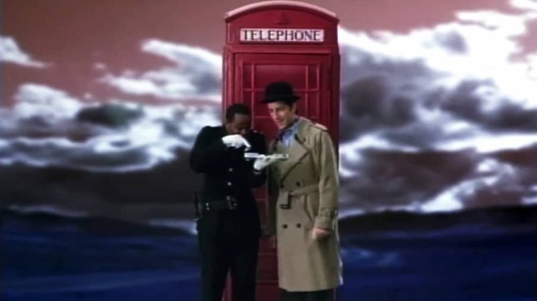Derwin Jordan as Constable Reggie and Travis Richey as Inspector Spacetime, as watched by the characters on Community
