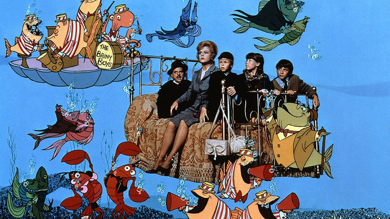 David Tomlinson, Angela Lansbury, Roy Snart, Cindy O'Callaghan, and Ian Weihill as Mr. Browne, Miss Price, Paul Carrie, and Charlie riding their bed through the beautiful briny sea in Bedknobs and Broomsticks