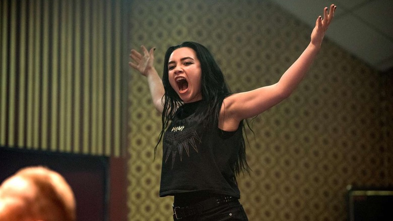 Florence Pugh as Saraya/Paige yelling and holding her arms out in Fighting With My Family