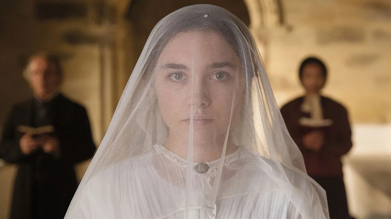 Florence Pugh as Katherine with a bridal veil over her head in Lady Macbeth