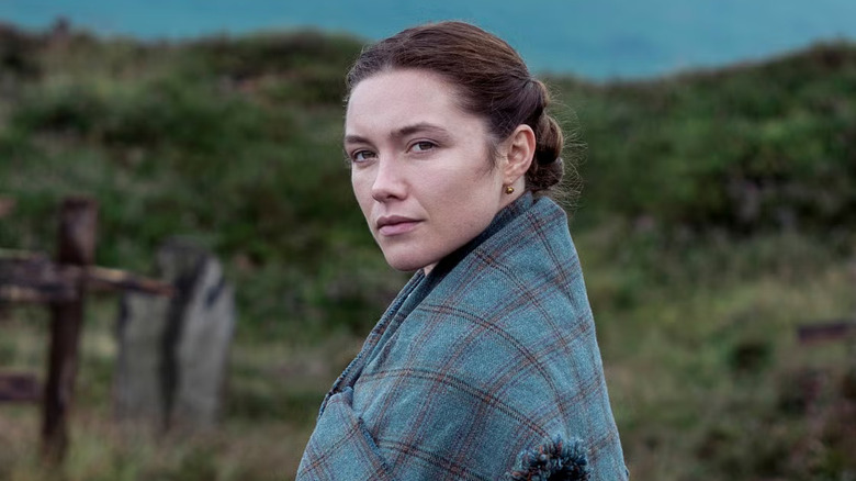 Florence Pugh as Lib Wright looking over the mountains in The Wonder