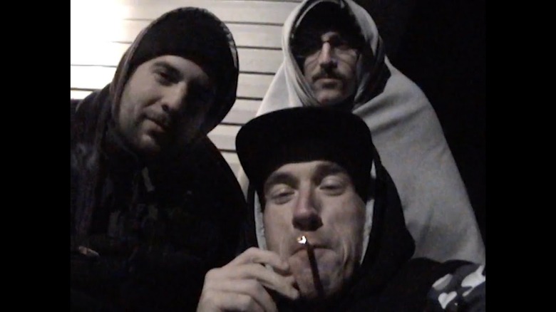Eric Rahill as Jason, Conner O'Malley as Matt, and Jack Bensinger as Casey wearing outerwear and standing next to a house in Rap World