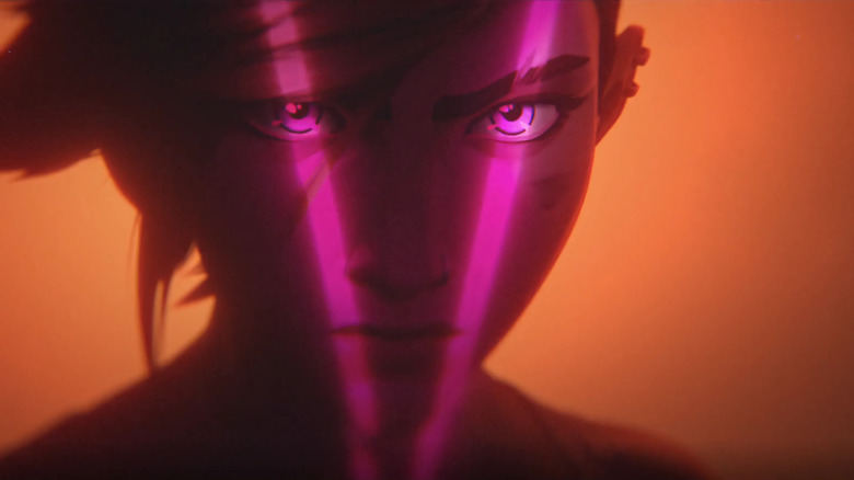 Violet with a V-shaped pink light over her face in Arcane