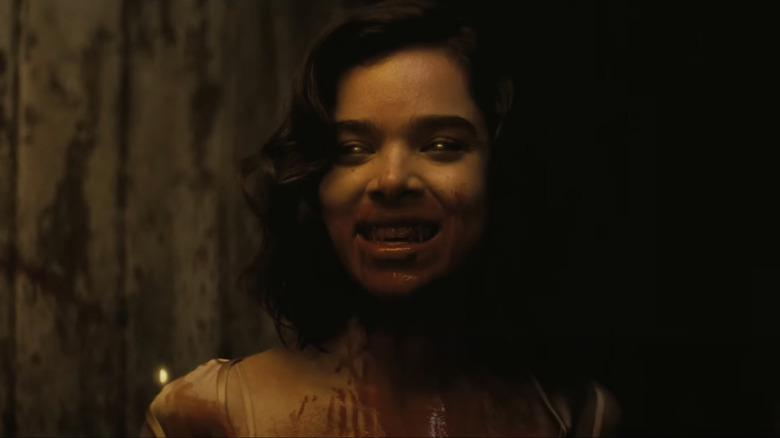 Hailee Steinfeld as Mary with black eyes and her mouth covered in blood in Sinners