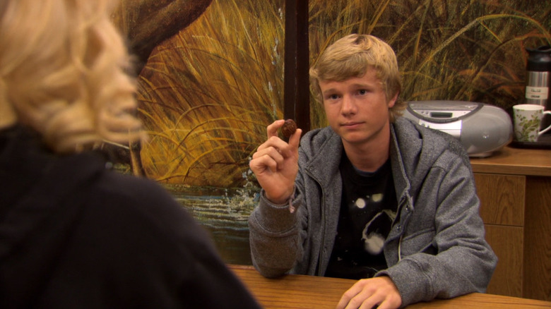 Greg Pikitis (Cody Klop) holding a candy on Parks and Recreation