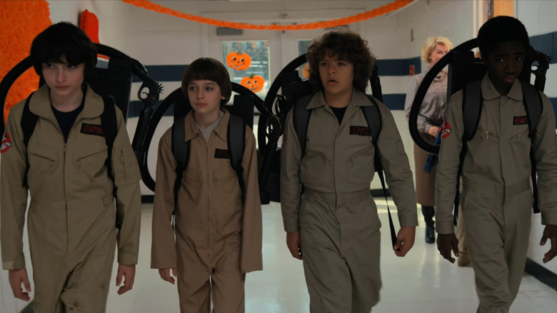 Four boys dressed up as Ghostbusters on Stranger Things