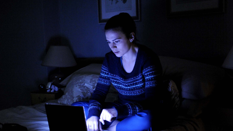 Hayley Atwell as Martha, looking down at her laptop on Black Mirror