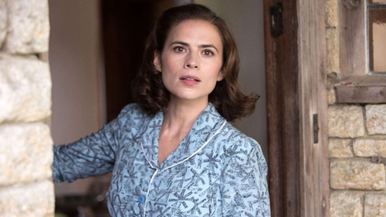 Hayley Atwell as Evelyn, looking out her door in Christopher Robin
