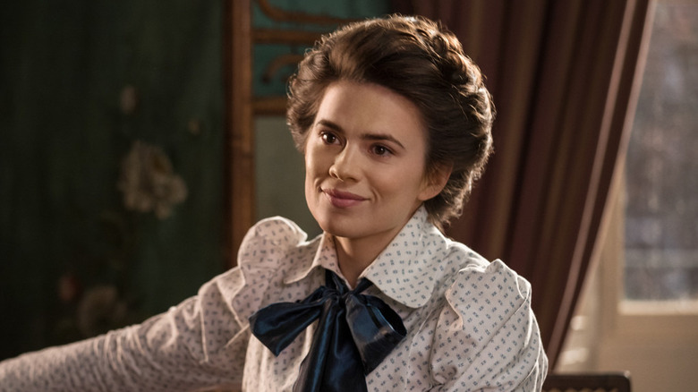 Hayley Atwell as Margret, smiling in a common room on Howard's End