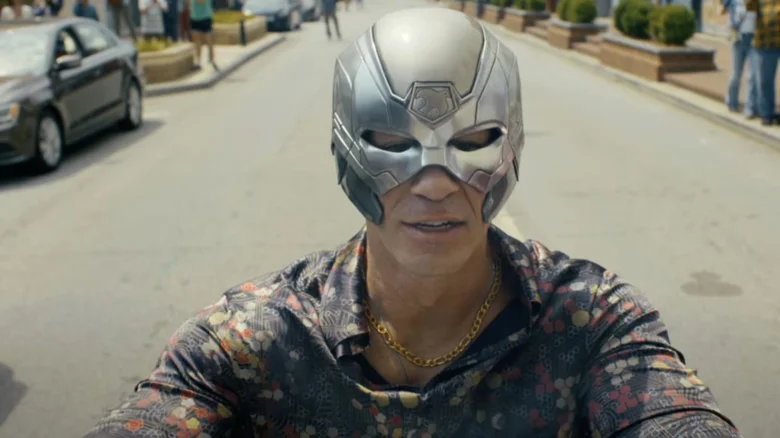 Christopher Smith cruises down the street in his immaculate fit in Peacemaker