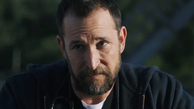 Noah Wyle's  Dr. Michael Robinavitch is seen in closeup on the hospital roof in The Pitt