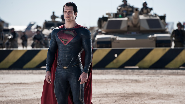 Henry Cavill as Superman standing in front of a military blockade in Man of Steel