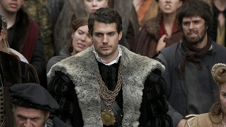 Henry Cavill as Charles Brandon walking through a crowd in The Tudors