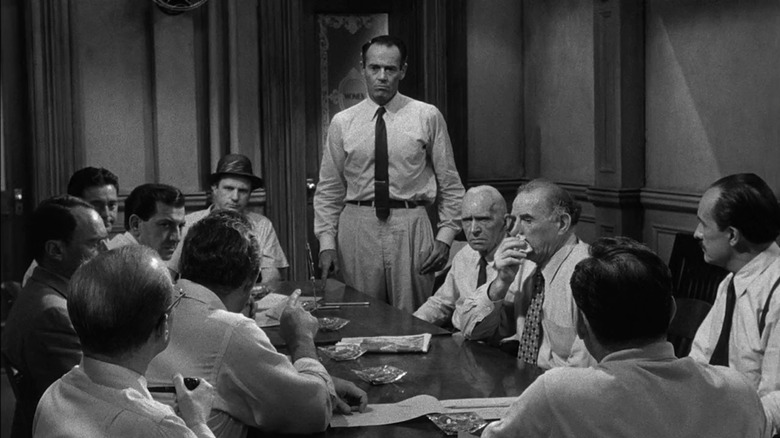 Juror 8 (Henry Fonda) standing in deliberation room in 12 Angry Men