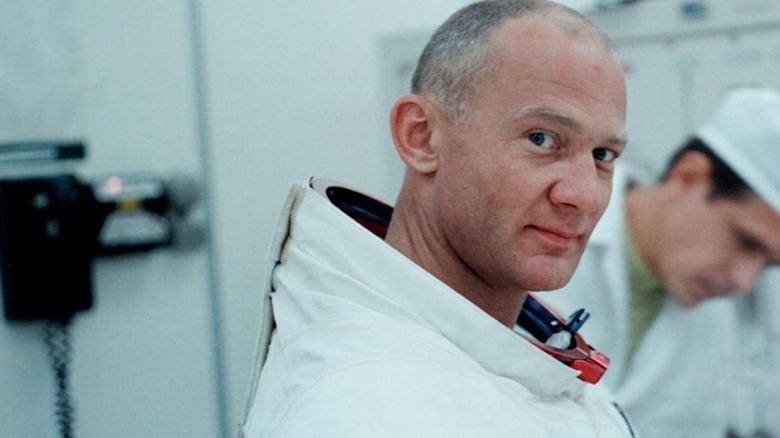 Buzz Aldrin smiles while looking into the camera and wearing his spacesuit in Apollo 11 (2019)