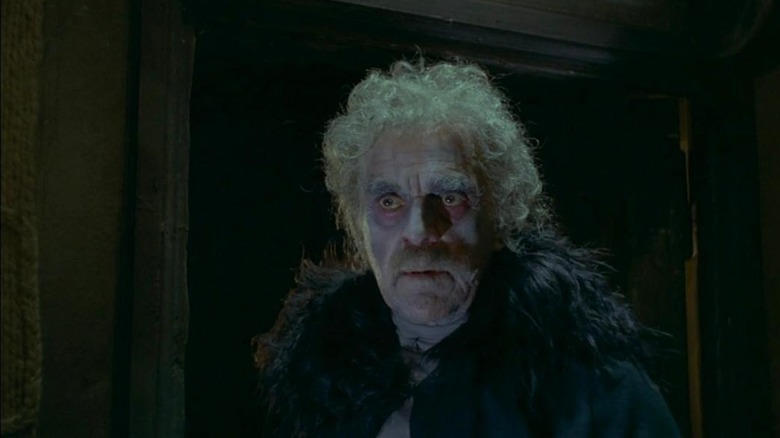 Boris Karloff as Gorca in Black Sabbath, looking drained of color with crazed hair and dark eyes as he looks at something out of frame.