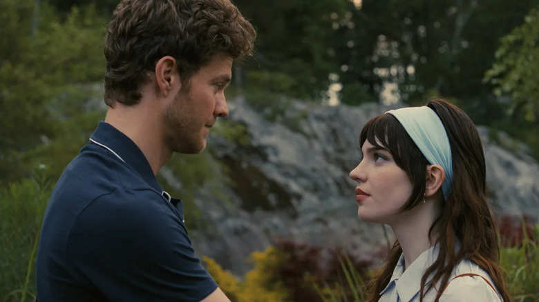 Jack Quaid as Josh Beeman and Sophie Thatcher as Iris, looking into each others eyes in Companion.