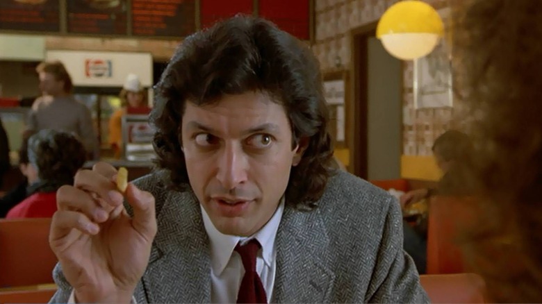 Jeff Goldblum as Seth Brundle, eating at a restaurant in The Fly.