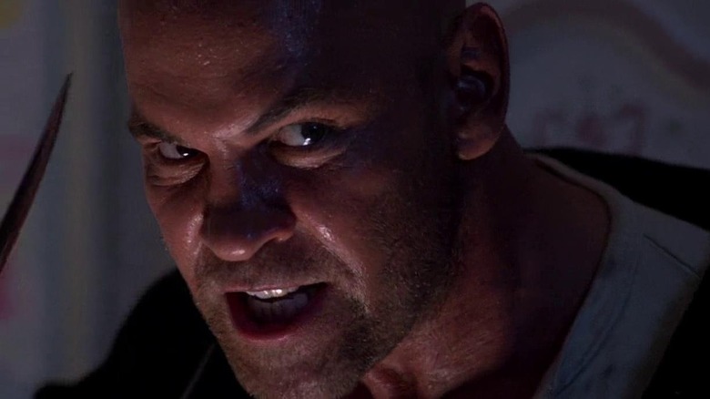 A close-up of Mitch Pileggi as Horace Pinker in Shocker, looking violently angry at something past the frame.