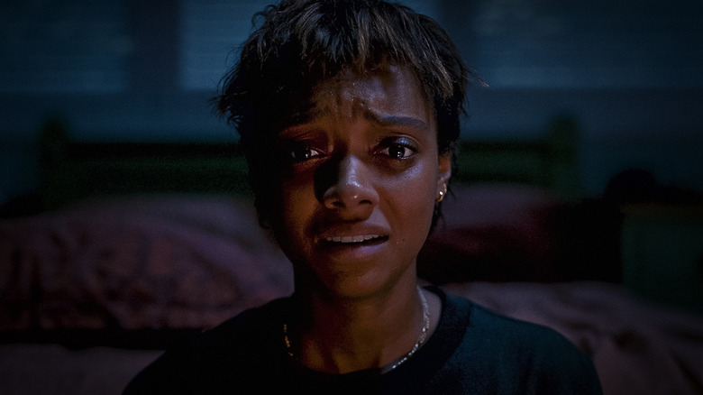 Sophie Wilde as Mia, staring forward and crying in Talk to Me