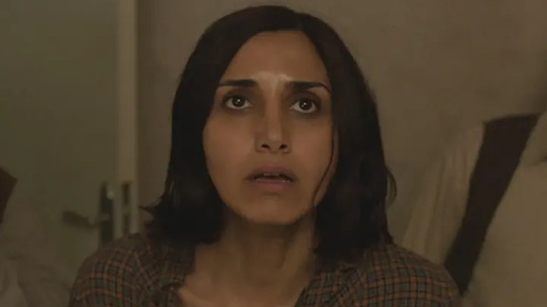 Narges Rashidi as Shideh, looking up in fear in Under the Shadow