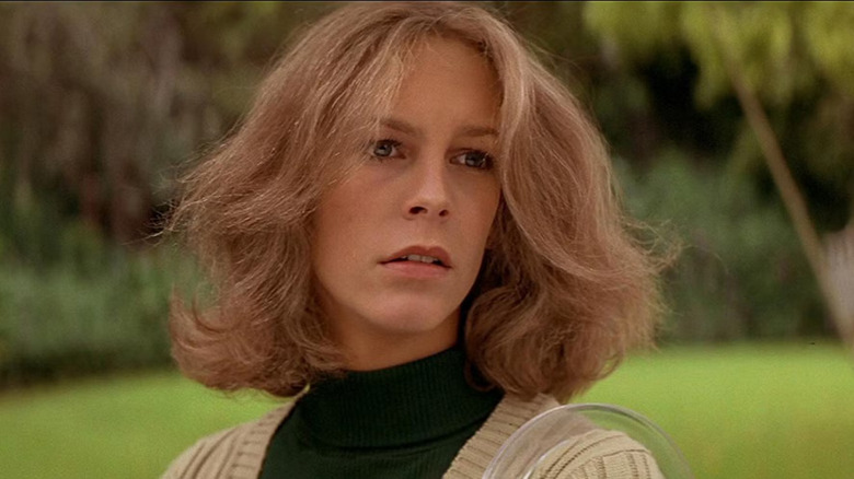 Jamie Lee Curtis as Laurie, worrying that someone is following her in Halloween