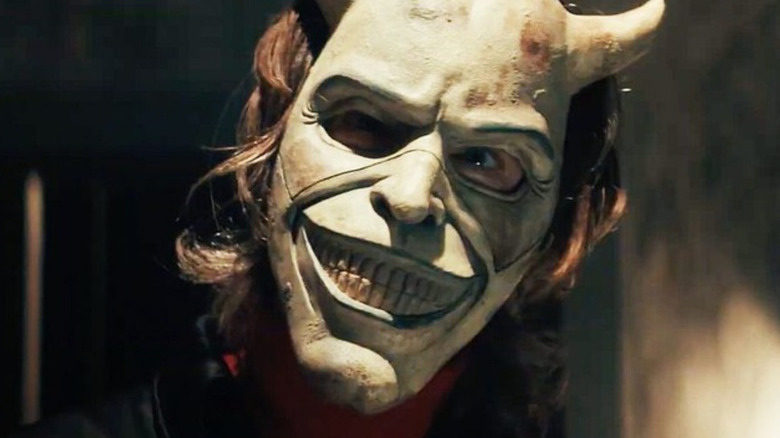 The Grabber (Ethan Hawke) glares through his mask in The Black Phone