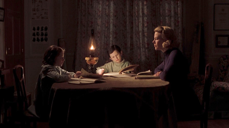 Nicole Kidman as Grace Stewart in The Others, addressing her children at a table.
