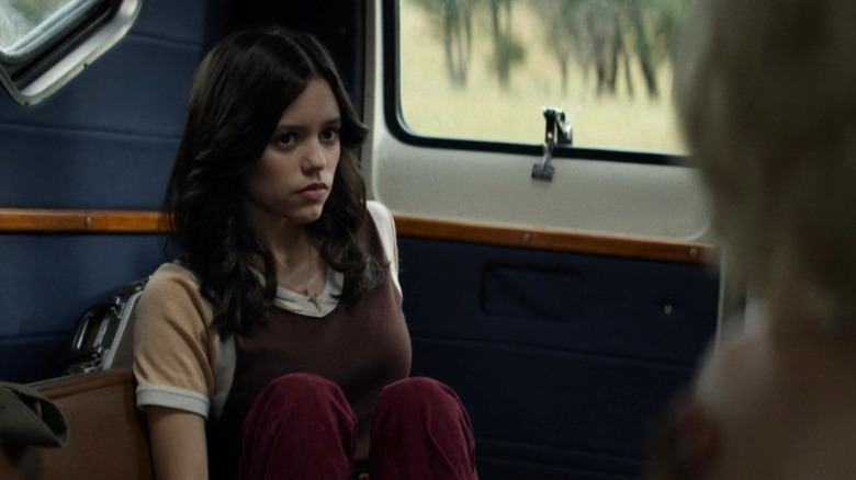 Jenna Ortega as Lorraine Day sitting at the back of a van in X
