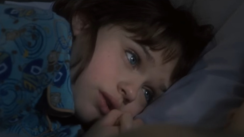 Joey King as Ramona, laying in bed in Ramona and Beezus