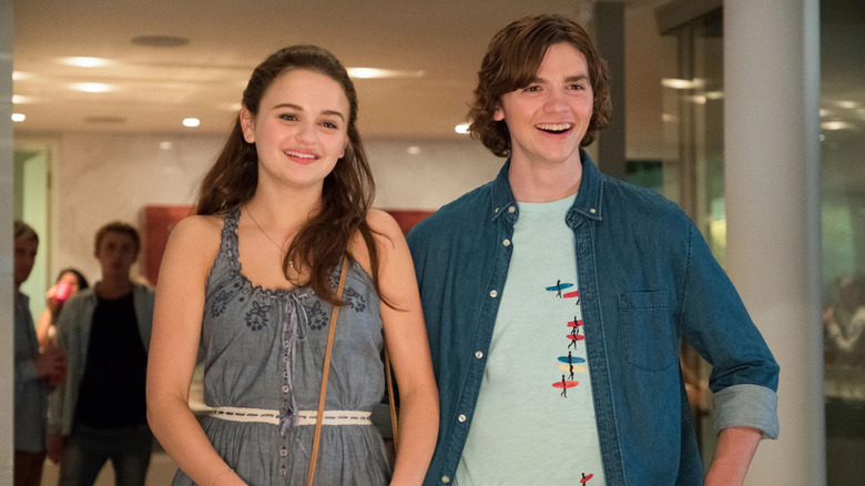 Joel Courtney and Joey King as Lee and Elle, smiling together in the Kissing Booth