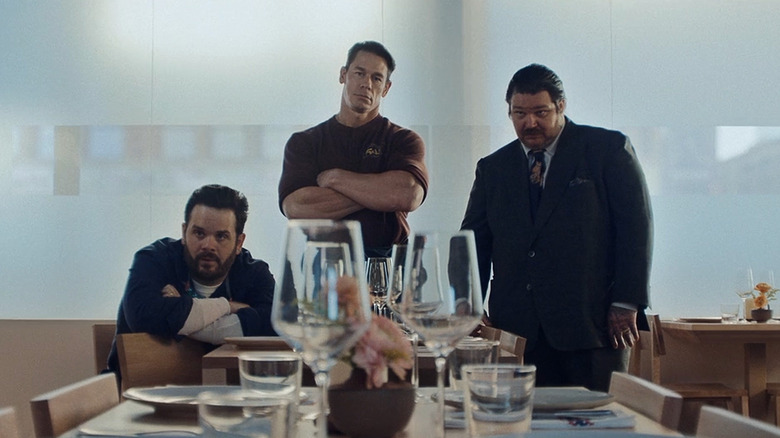 Ricky Staffieri, John Cena, and Matty Matheson as Teddy, Sammy, and Neil Fak staring at set tables in The Bear