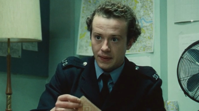 Joseph Quinn as PC Dixon, playing card in Small Axe