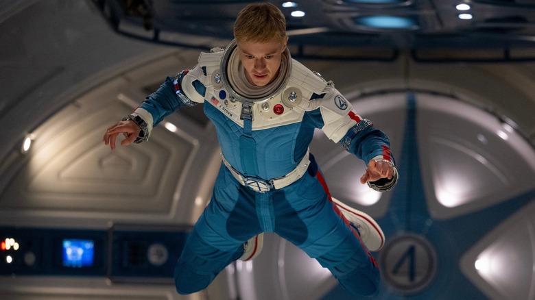 Joseph Quinn as Johnny Storm, hovering in zero gravity in The Fantastic Four: First Steps
