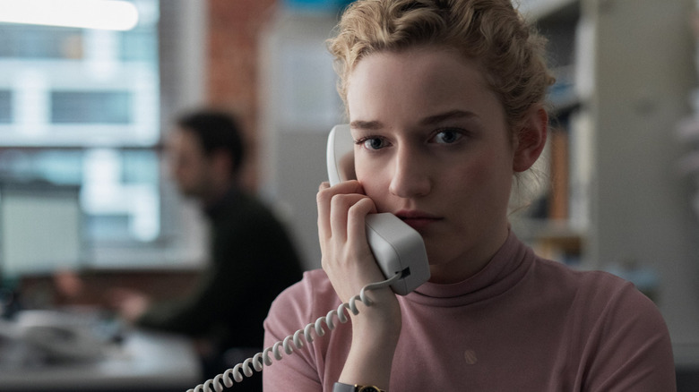 Julia Garner as Jane, taking a phone call in The Assistant
