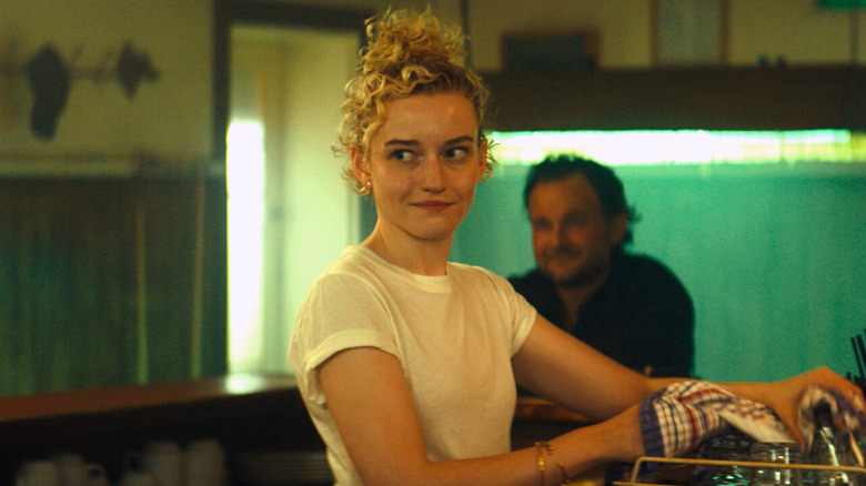 Julia Garner as Hanna, washing dishes in  The Royal Hotel
