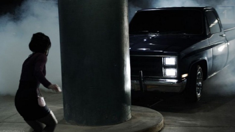 the alien car in pickup form, terrorizing a victim in Super Hybrid