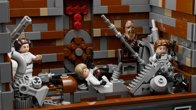 A LEGO model of Luke, Leia, Han, and Chewbacca surviving the trash compactor