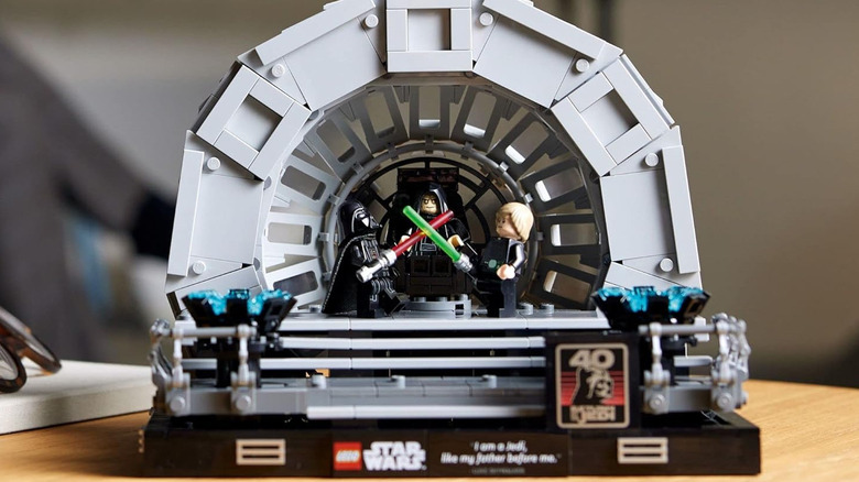 A LEGO model of The Emperor watching Luke and Darth Vader fight in his throne room