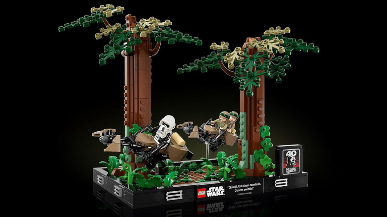 A LEGO model of Luke and Leia chasing a storm trooper on a speeder