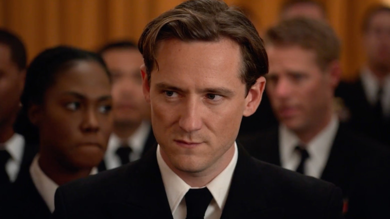 Lewis Pullman as Keefer sitting in a court room in The Caine Mutiny Court-Martial