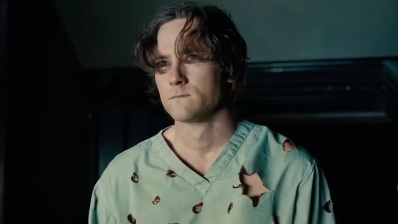 Lewis Pullman as Bob with a bullet riddled shirt in Thunderbolts