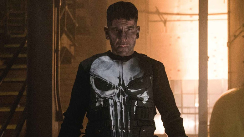 Jon Bernthal as Frank Castle dons his iconic white skull on a bulletproof vest in The Punisher